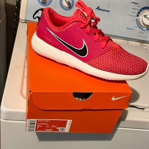 Nike Pink and White Athletic Shoes Sleek Design